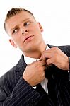 Businessman Tucking The Button Stock Photo