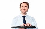 Businessman Typing On Keyboard Stock Photo