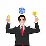 Businessman Under Brain And A Light Bulb Stock Photo