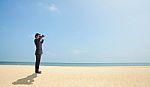 Businessman Using Binoculars Stock Photo