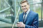 Businessman Using His Mobile Phone Stock Photo