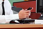 Businessman Using Smart Phone During Working Stock Photo