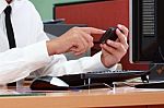 Businessman Using Smart Phone During Working Stock Photo