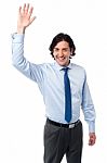 Businessman Waving Hi To His Colleague Stock Photo