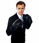 Businessman Wearing Boxing Gloves Stock Photo