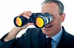 Businessman with Binoculars Stock Photo