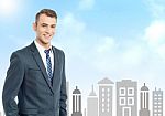 Businessman With City Skyline Background Stock Photo