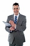 Businessman With Clipboard Stock Photo