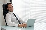 Businessman With Earphones Stock Photo