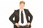 Businessman With Hands On Hips Stock Photo