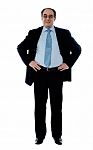 Businessman With Hands On Waist Stock Photo