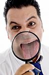 Businessman With Magnified Tongue Stock Photo