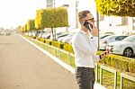 Businessman With Mobile Phone And Tablet In Hands Stock Photo