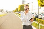 Businessman With Mobile Phone And Tablet In Hands Stock Photo