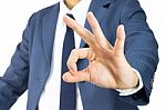 Businessman With Ok Sign Hand Gesture Isolated Stock Photo