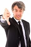 Businessman With Thumb Down Stock Photo