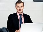 Businessman Working On Laptop Stock Photo