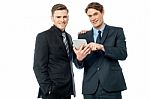 Businessmen Browsing On Tablet Device Stock Photo