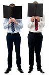 Businessmen Hiding Their Faces With Files Stock Photo