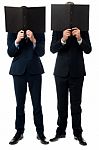 Businessmen Hiding Their Faces With Folder Stock Photo