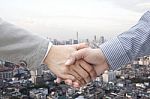 Businessmen Shaking Hands Stock Photo