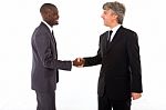 Businessmen Shaking Hands Stock Photo