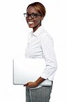 Businesswoman Carrying Laptop Stock Photo