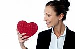 Businesswoman Displaying Her Valentine Gift Stock Photo