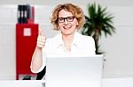 Businesswoman Gesturing Thumbs Up Stock Photo