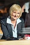 Businesswoman In An Open Restaurant Stock Photo