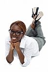 Businesswoman Lying On Floor Stock Photo