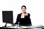 Businesswoman Pointing At The Viewer In Her Office Stock Photo