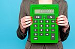 Businesswoman Showing Calculator Stock Photo