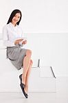 Businesswoman Sitting Stairs Holding Digital Tablet Stock Photo