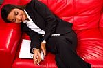 Businesswoman Sleeping On Sofa Stock Photo