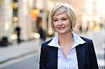 Businesswoman Standing In Street Stock Photo