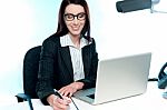 Businesswoman Writing An Important Document Stock Photo