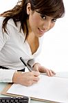 Businesswoman writing on Papers Stock Photo