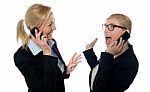 Businesswomen On Cellphones Stock Photo