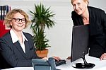 Businesswomen Sitting In Modern Office Stock Photo