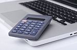 Calculator On The Laptop Keyboard Stock Photo