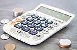 Calculator With Money On Grey Background Stock Photo