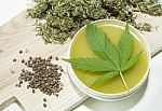 Cannabis Home Made Healing Ointment And Marijuana Green Leaf And Seeds Stock Photo