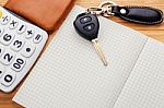 Car Key On Blank Notebook With Pocket Money Stock Photo