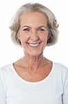 Casual Aged Woman Posing For Camera Stock Photo