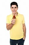 Casual Boy Posing With Pizza Slice Stock Photo