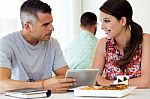 Casual Executives Working Together At A Meeting With Digital Tab Stock Photo