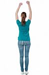 Casual Female Raising Her Hands Stock Photo