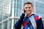 Casual Male Executive Talking Via Mobile Phone Stock Photo