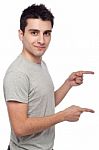 Casual Man Pointing Stock Photo